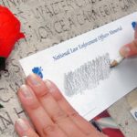 A rubbing of Jim's name on the wall